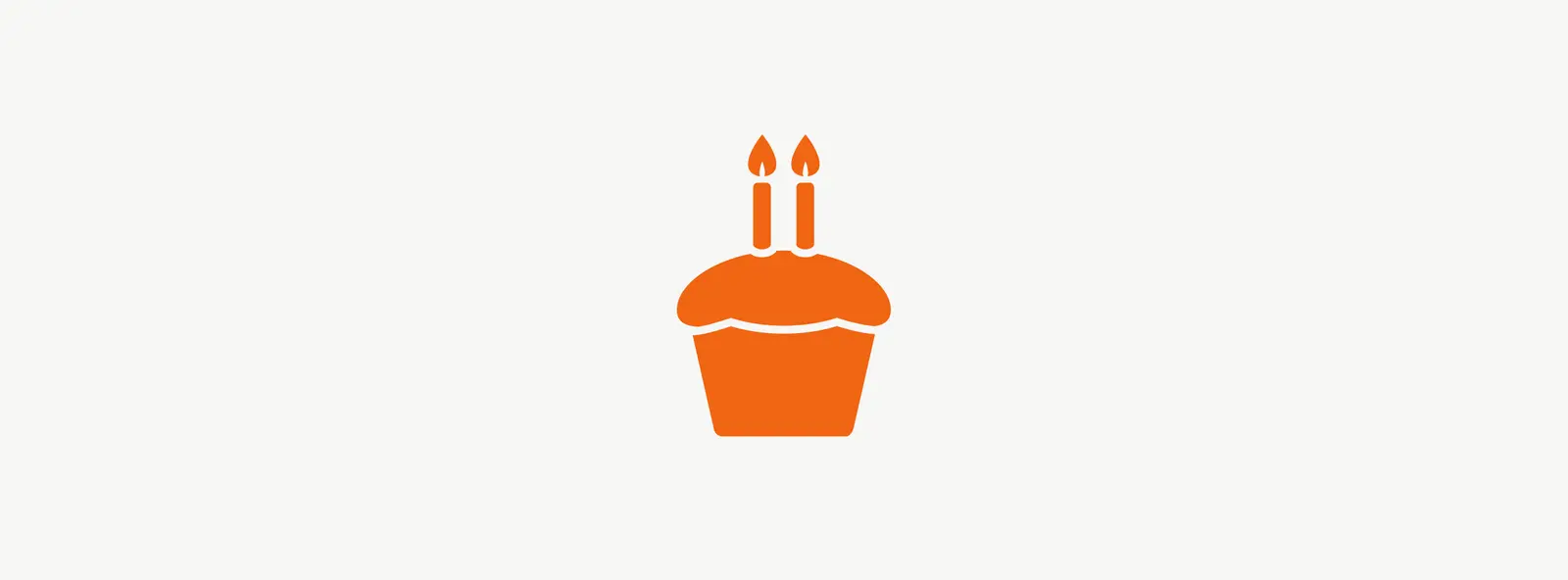 Illustration of cupcake with two candles celebrating second anniversary